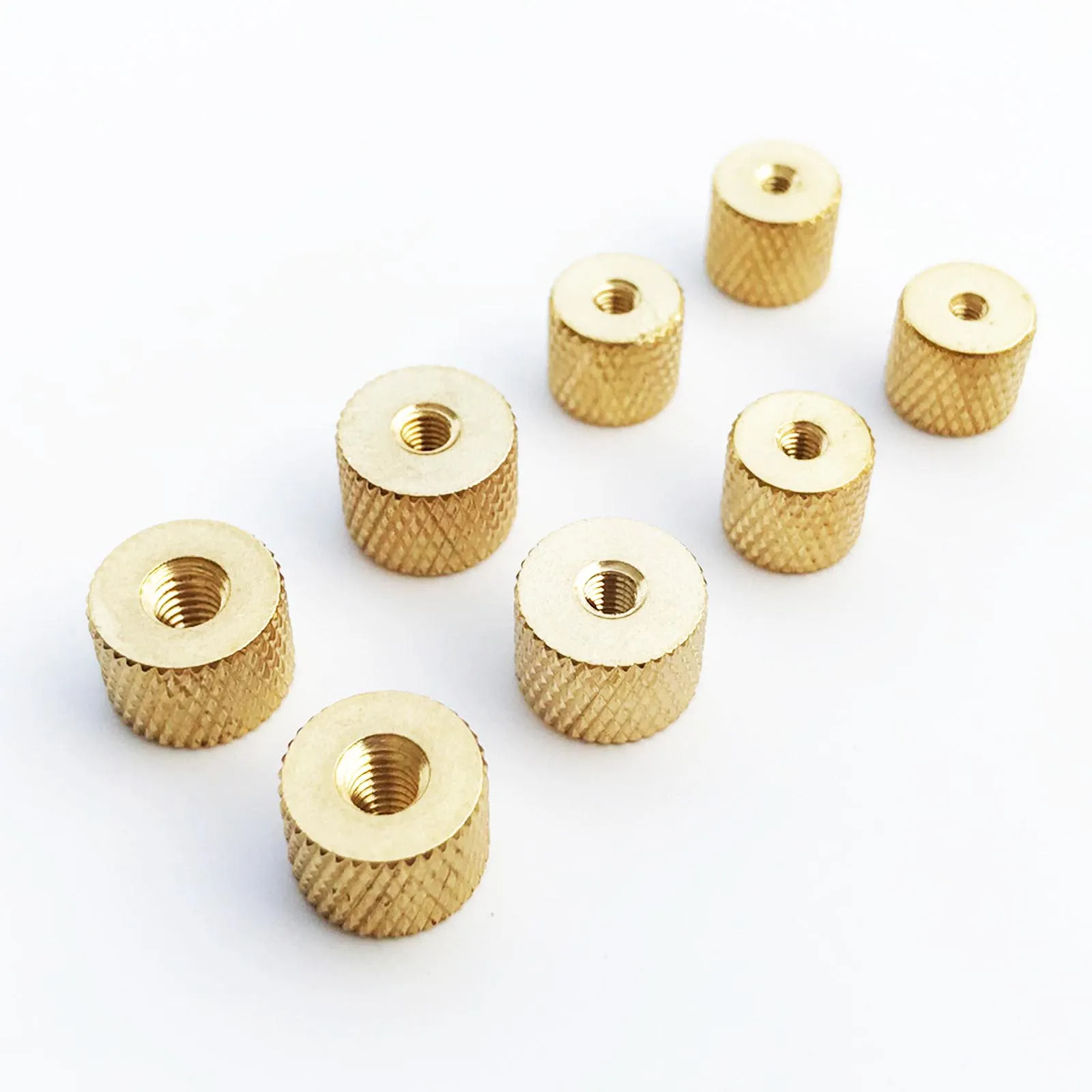 Five brass copper cylindrical knurled thumb nuts with pineapple pattern, used for adjusting air or water cooling fans in PC cases and DIY models.