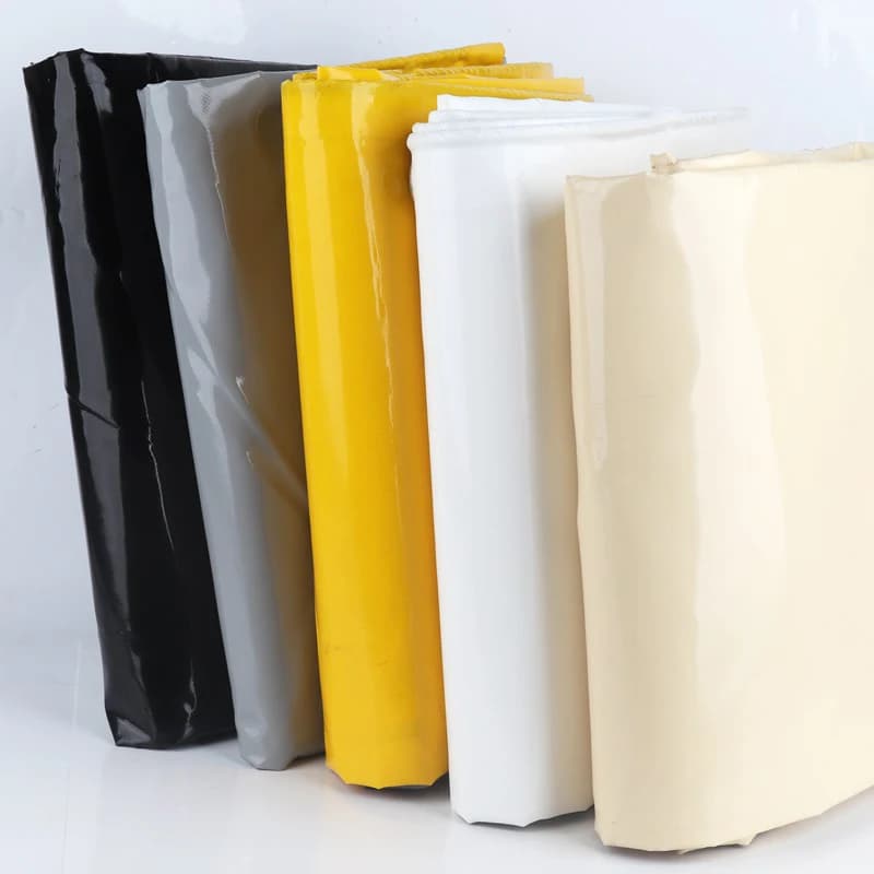 Custom PVC & PE Tarpaulin rolls in various colours, showing product variants.
