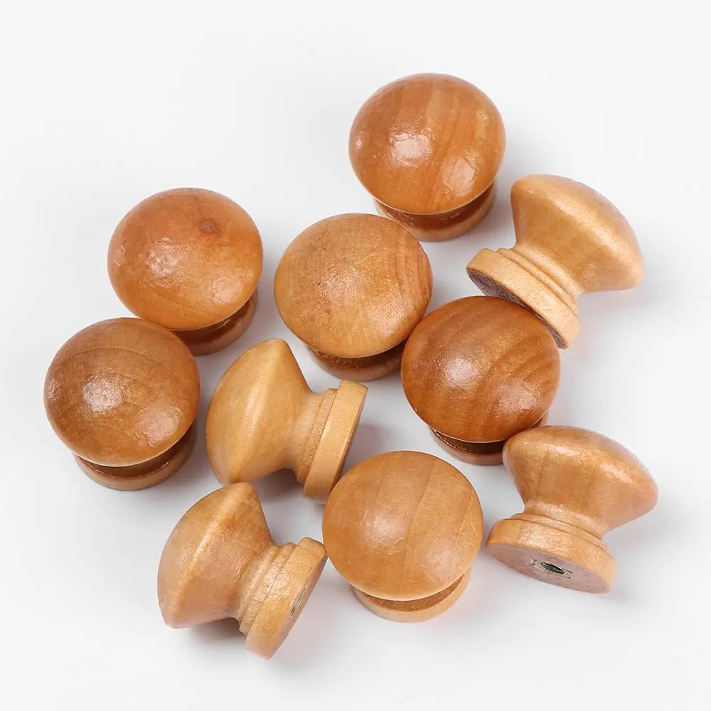 Ten round-shaped natural wooden cabinet knobs with light wood grain, suitable for drawers, wardrobes, and furniture doors as pull handles.