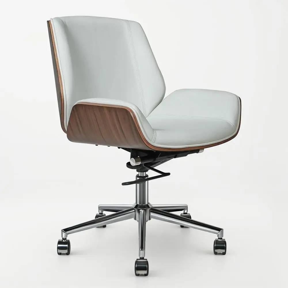 Armless low-back office chair upholstered in genuine leather, featuring a swivel base and minimalist design for compact workspaces.