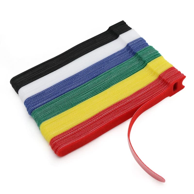 250mm cavity wall ties: Stack of colourful hook and loop cable ties, one red partially unrolled.