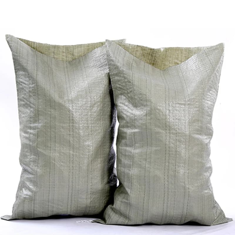 Two light-coloured woven rubble sacks on a white background.