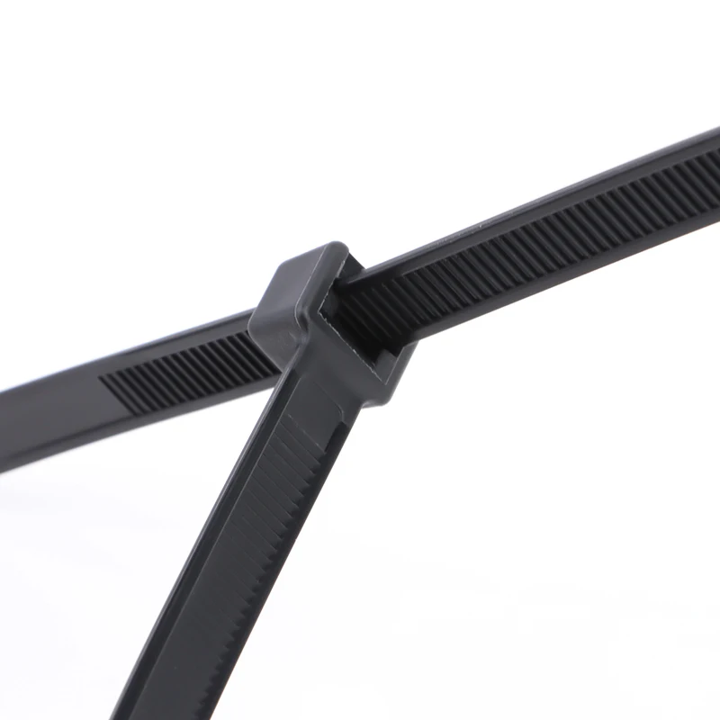 Cavity wall ties: close-up of a black tie on a white background.