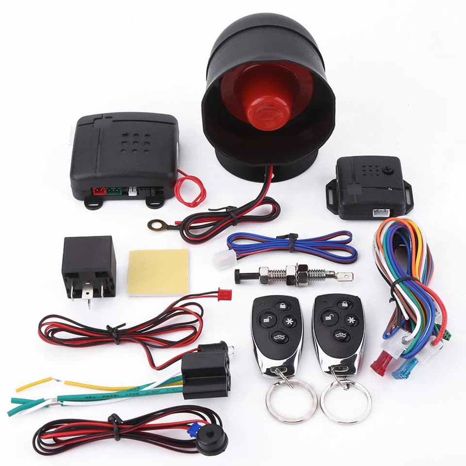A complete car alarm security system with keyless entry and two remote car starter controls.