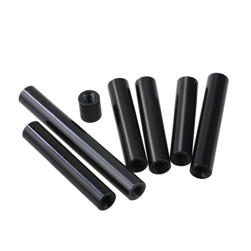 Standoff for RC Models: black cylindrical spacers and one threaded nut on a white background.