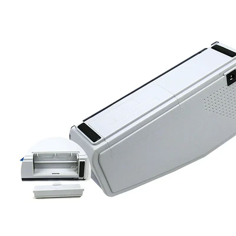 Portable Counting Note Machine with open battery compartment on white.