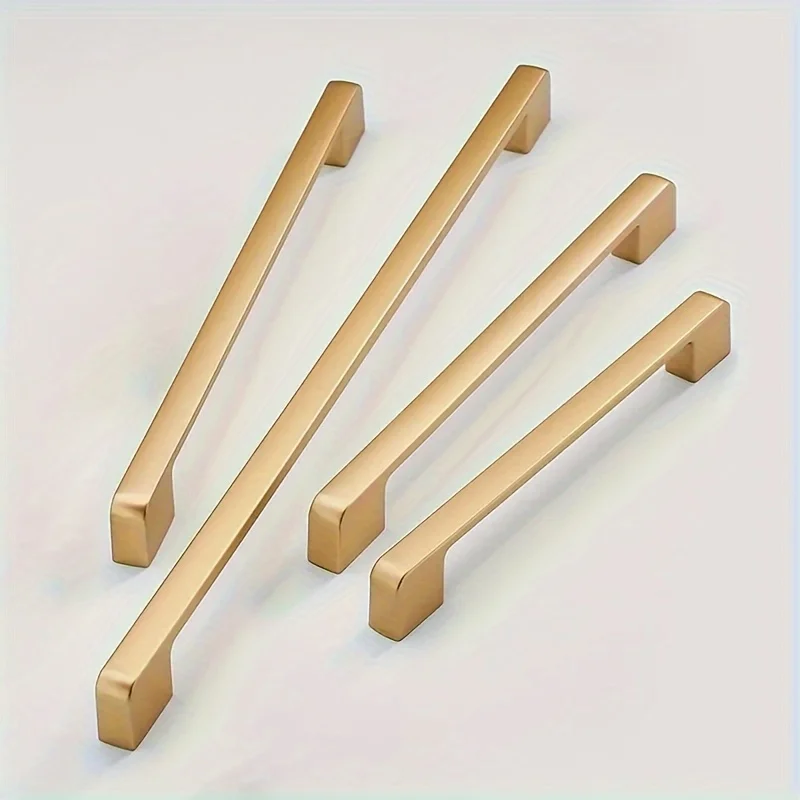 Elegant matte golden aluminum alloy handles with durable painted finish for kitchen cabinets and furniture drawers.