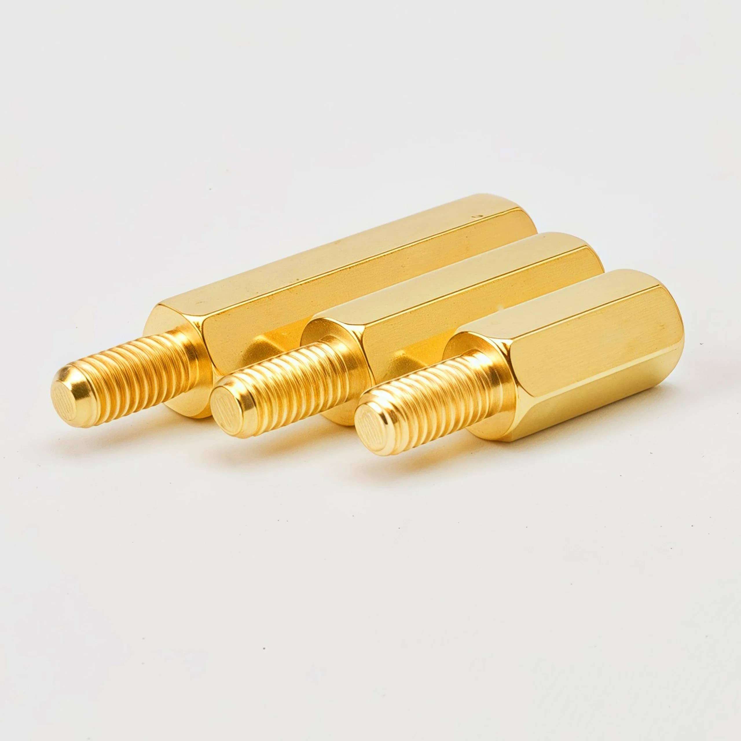 Hex brass motherboard standoffs with male-female threading in M2.5, M3, and M4 sizes for PCB mounting and spacing.