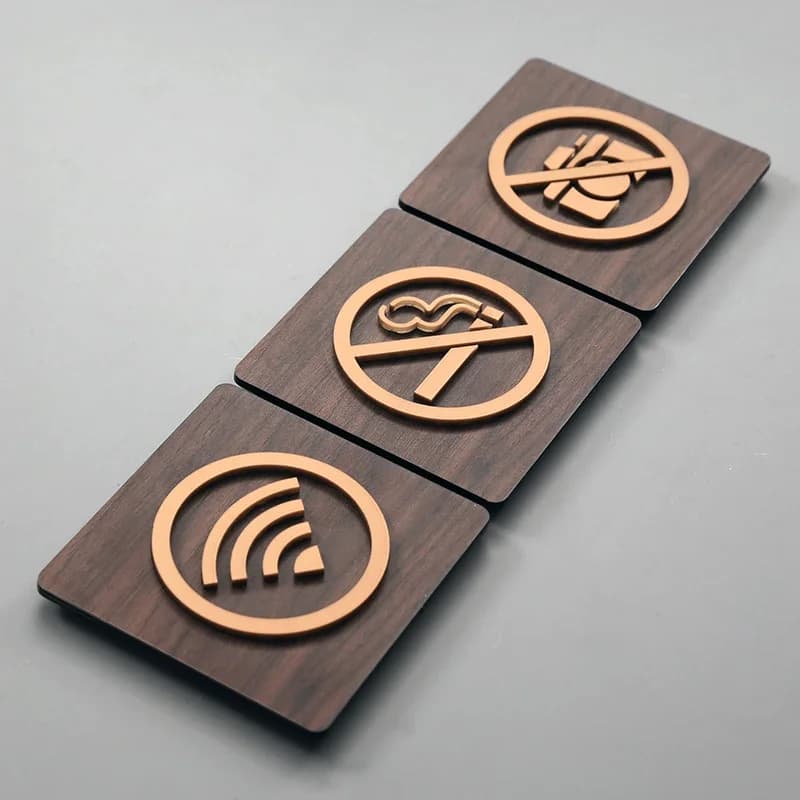 No Smoking Sign Printable: three wooden square tiles with prohibition symbols on a light gray background.