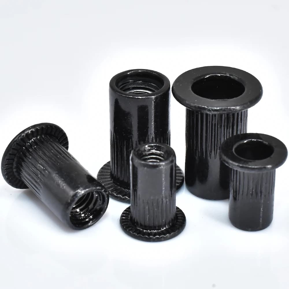 Black carbon steel flat head rivet nuts in sizes M3 to M12, also known as Nutserts, sold in sets of 5 to 50 pieces for threaded inserts.