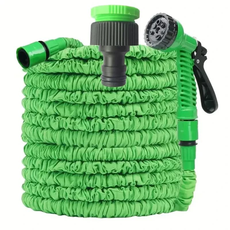 Expandable garden hose, green, with nozzle and connector on a white background.