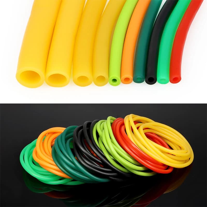 Washing machine hose: multiple coloured tubes, some straight, some coiled, on a white and black background.