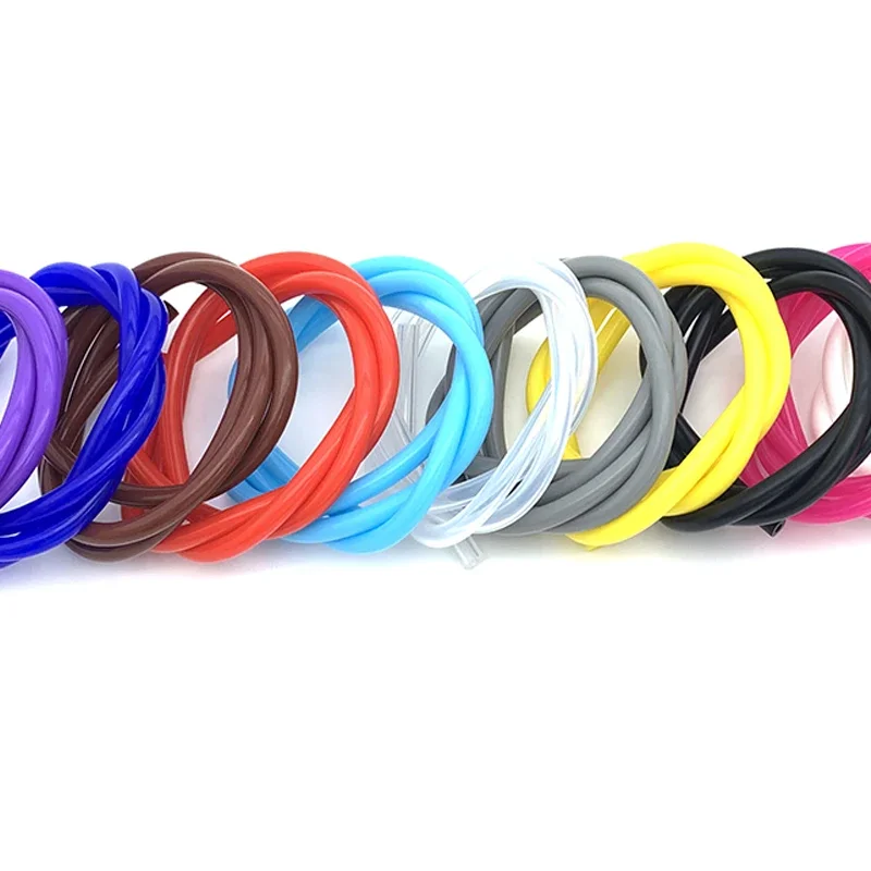 Silicone washing machine hose variants: multiple colourful coiled tubes on a white background.