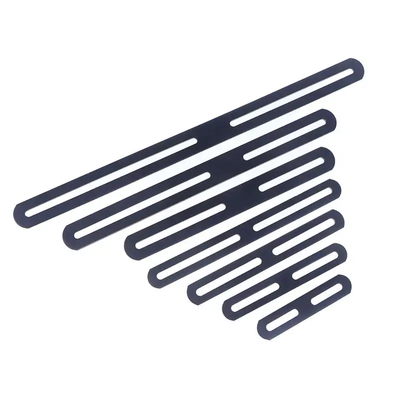 Angle brackets: multiple black, slotted strips arranged diagonally on a white background.