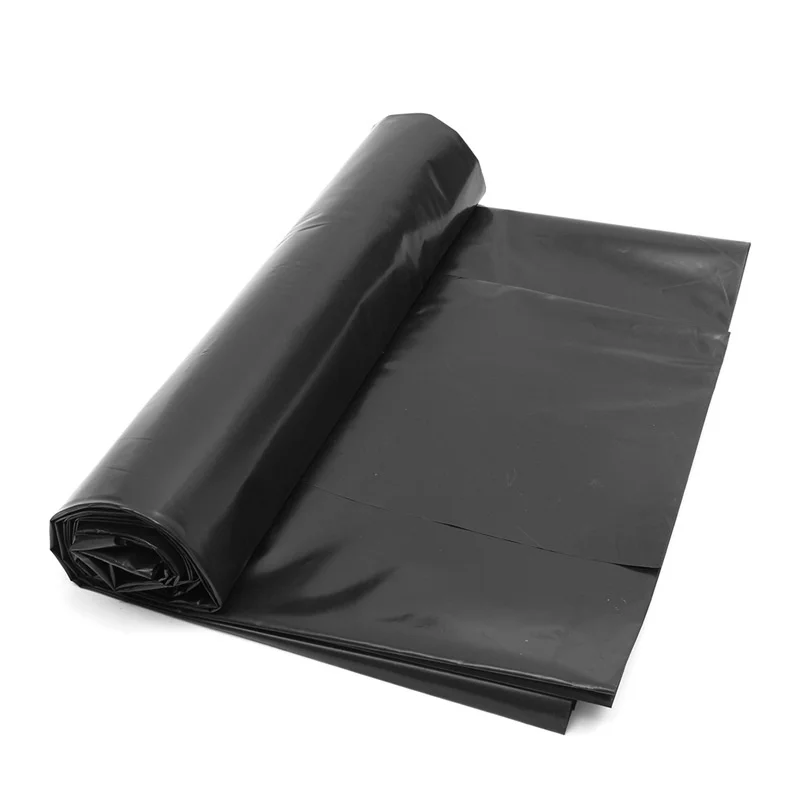 Geotextile membrane, black plastic sheet rolled up on a white background.