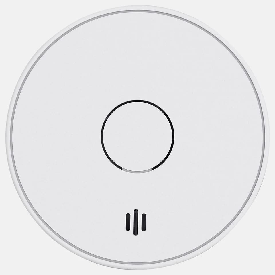 Smoke Detector VS02: white circular device with black circle and three lines on plain background.