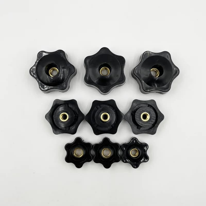 Black thumb nuts with star-shaped handles for manual tightening, available in various thread sizes including M4, M5, M6, M8, M10, and M12.