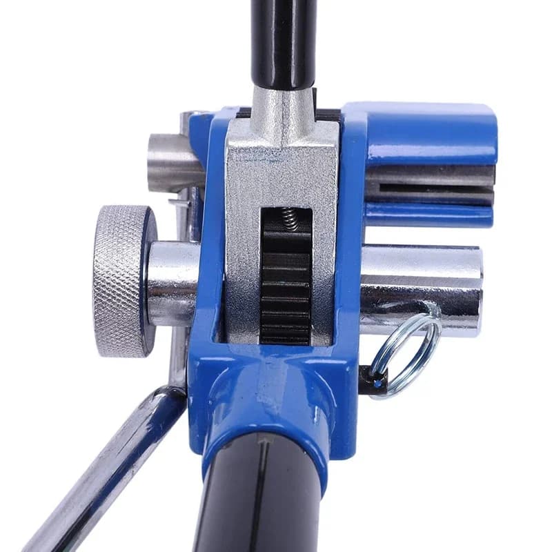 Cavity Wall Tie Tensioner: Close-up of a blue and silver tool on a white background.