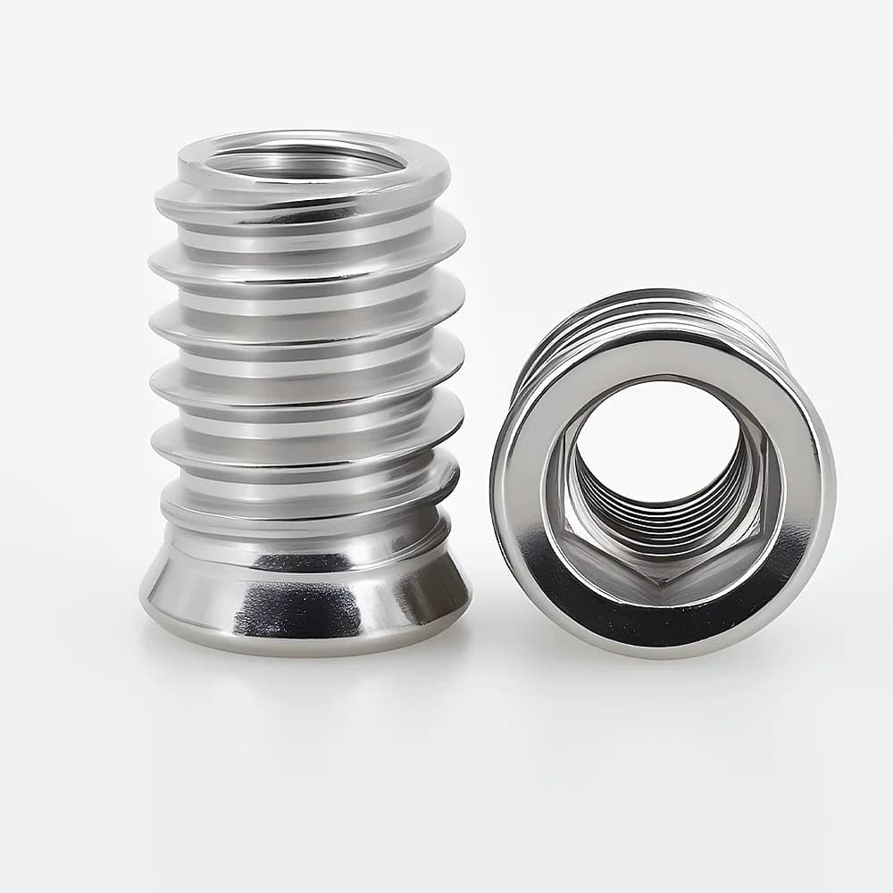 Stainless steel hex socket threaded insert nuts in various sizes (M4-M10) for furniture assembly, featuring embedded E-nut design for wood and cabinet applications.