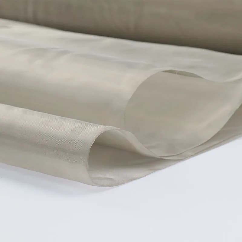 EMF Shielding Cloth Mesh Fabric, light-coloured and sheer with subtle folds.