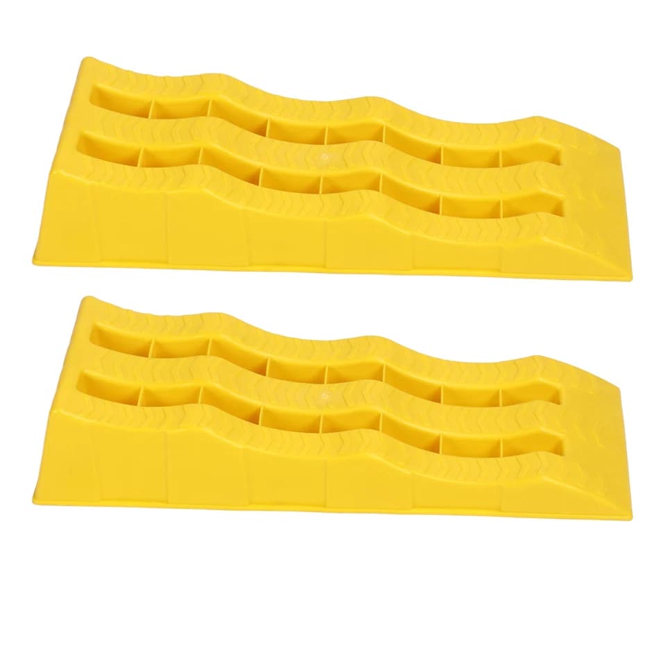 Two black 3-stage RV leveling ramps, robust wheel chocks for stabilizing vehicles on uneven ground.