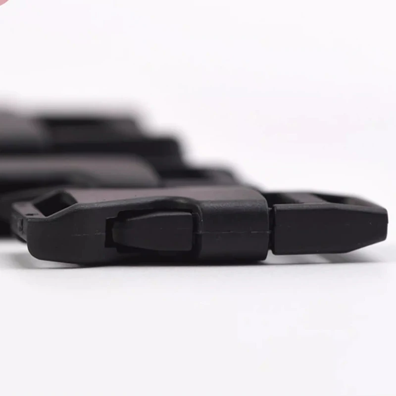 Quick-Clip Side Release Buckles: several black plastic buckles on a white background.