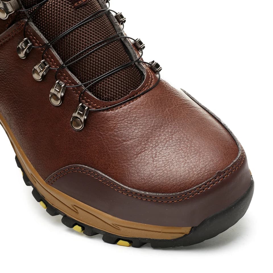 Steel toe cap safety boots: a single brown boot, close-up on a white background.