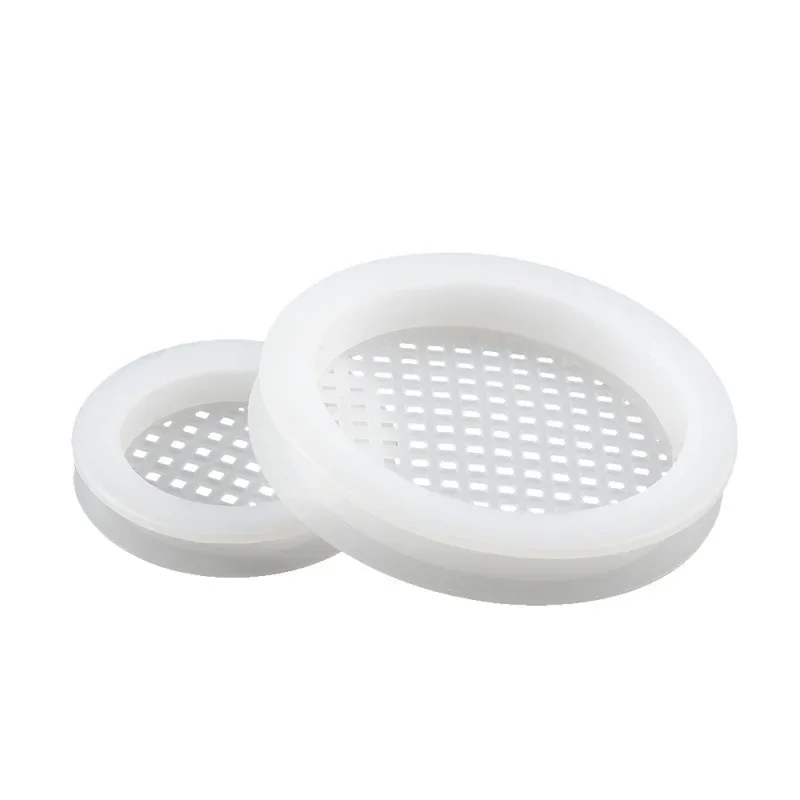 Soffit Vent Covers: Two white, circular, perforated silicone gaskets on a clean white background.