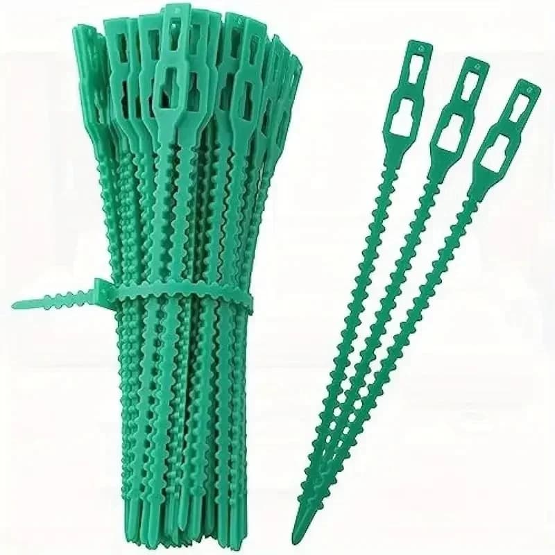 Cavity wall ties: a bundle of green plastic ties and three loose ties on white.