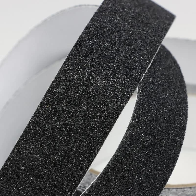 Floor Marking Tape: Black anti-slip tape roll on a light background.