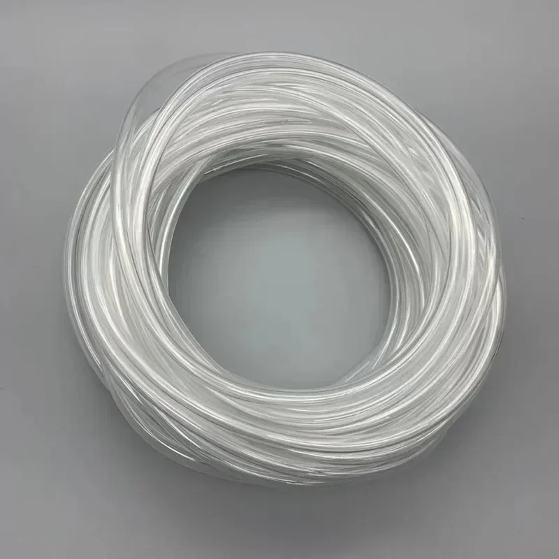 Washing machine hose: coiled clear tubing on a light grey background.