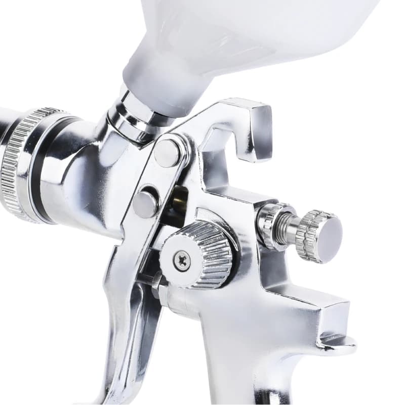 Professional HVLP spray gun with 1.4mm, 1.7mm, and 2.0mm nozzles for high atomization car painting and automotive refinishing.