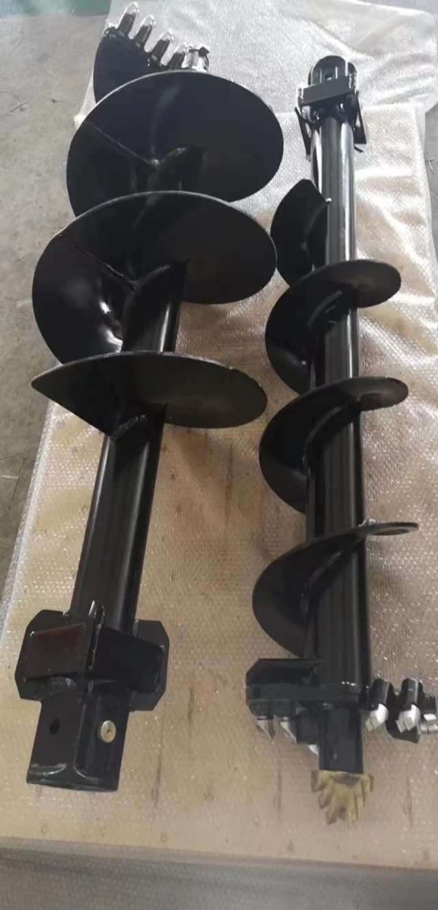 Hydraulic earth auger drill bit attachment for 1-3 ton skid steers and mini excavators, designed for ground boring and post hole digging.