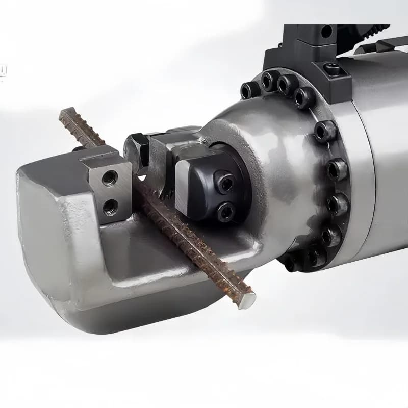 Electric hydraulic rebar cutter and bender machine cutting steel reinforcement bars on a construction site, portable and powerful.