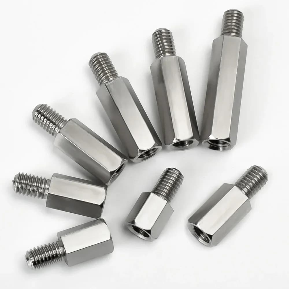 Assorted stainless steel PCB standoffs and spacers in various sizes (M2 to M10) with male-female hex design for electronic board support.