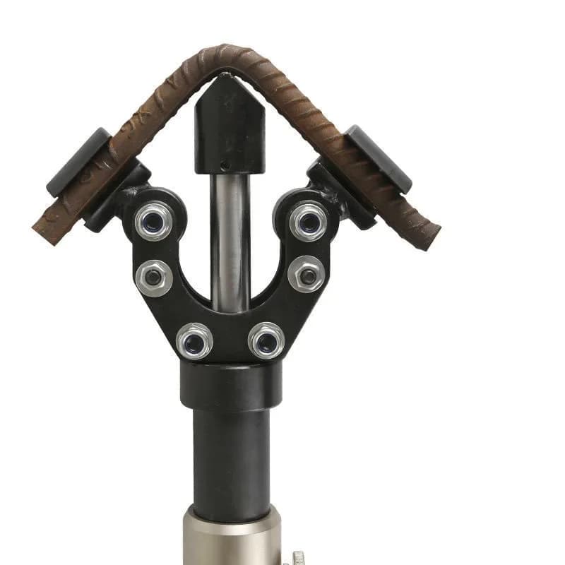 Professional manual hydraulic rebar bender for 10-14mm steel bars, featuring a reinforced steel frame and easy-grip handles on a workbench.