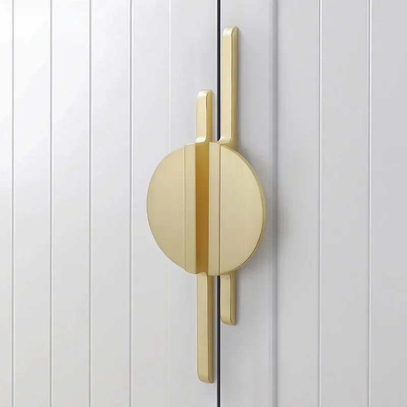 Modern golden bronze round cabinet knobs with simple design for kitchen cupboard doors, drawers, and furniture hardware.