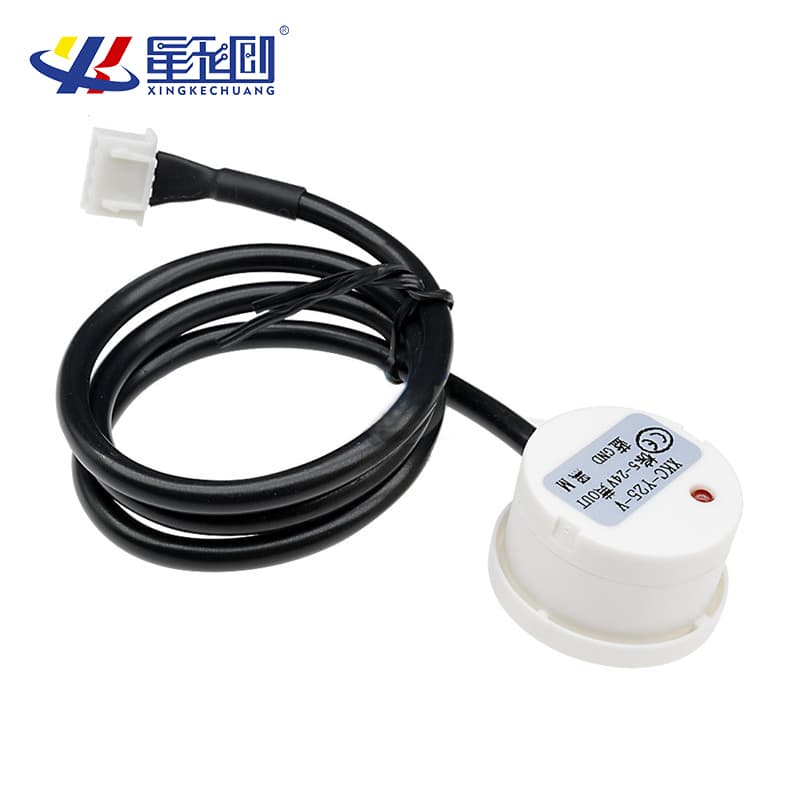 Close-up of an XKC-Y25 capacitive sensor for non-contact liquid level detection, ideal for water tanks.