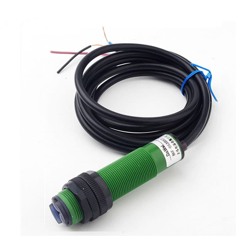 An adjustable diffuse-reflective photoelectric sensor proximity switch with a black cylindrical body and three wires.
