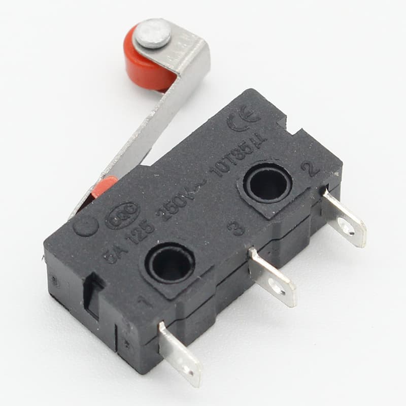 A set of ten mini micro limit switch components with roller lever arms, arranged on a white surface.