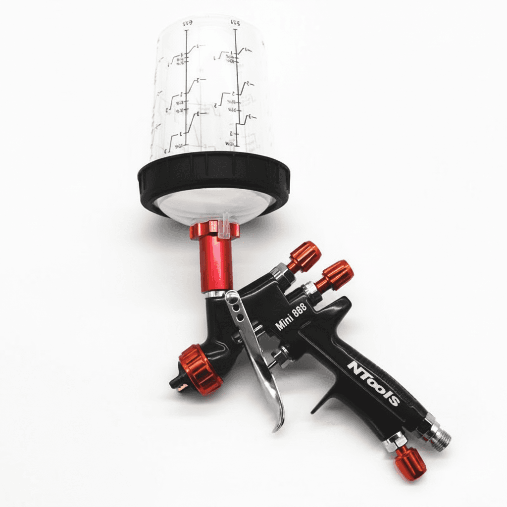 Paint sprayer with measuring cup, product text visible, white background.