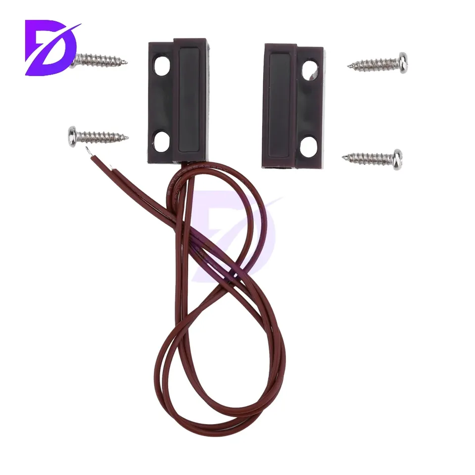 A white wired MC-38 door window magnetic reed switch, designed for home alarm systems and security.