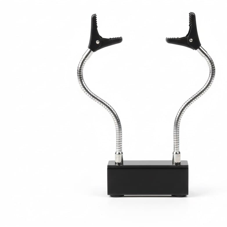 Soldering third hand with magnetic base and flexible arms.