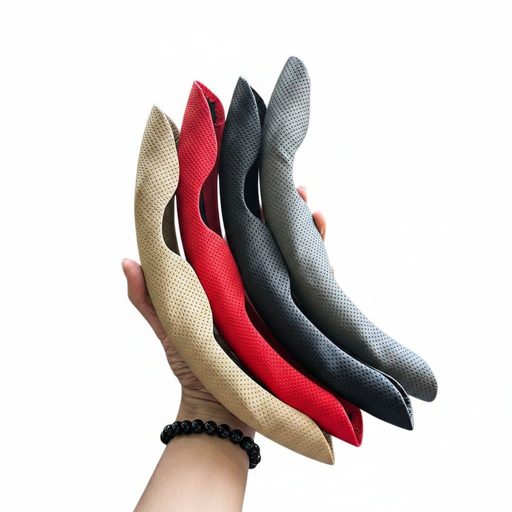 Black universal D-shaped steering wheel cover with ventilation holes, made from leather for enhanced grip and sweat absorption.