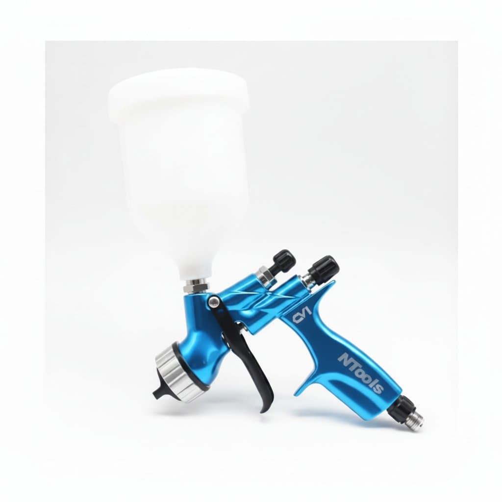 Blue HVLP spray gun with 1.3mm nozzle and 600ml cup for automotive painting, providing fine atomization for smooth finishes.