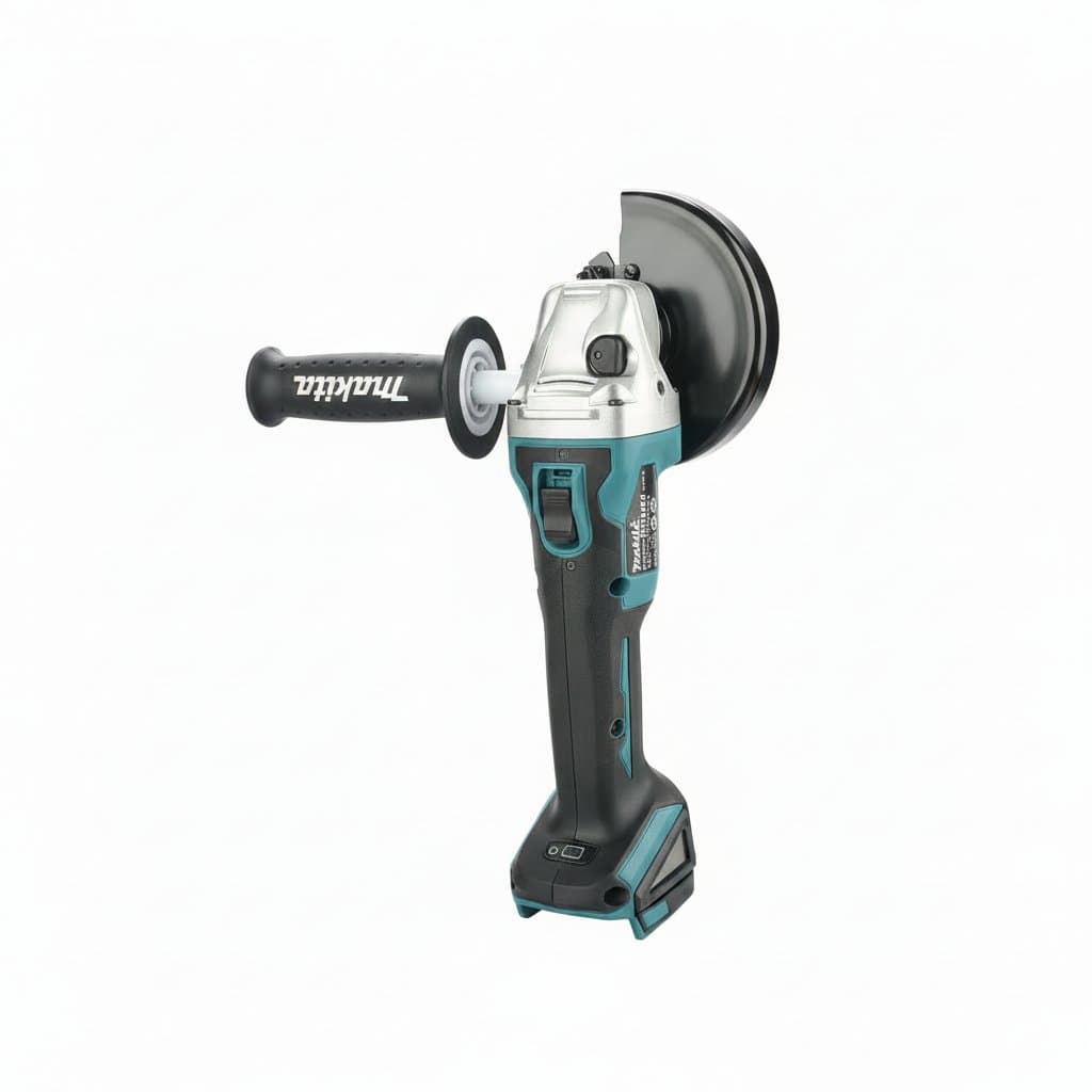 Makita 18V LXT cordless angle grinder with 125mm wheel, showing the tool held in a gloved hand on a workbench.
