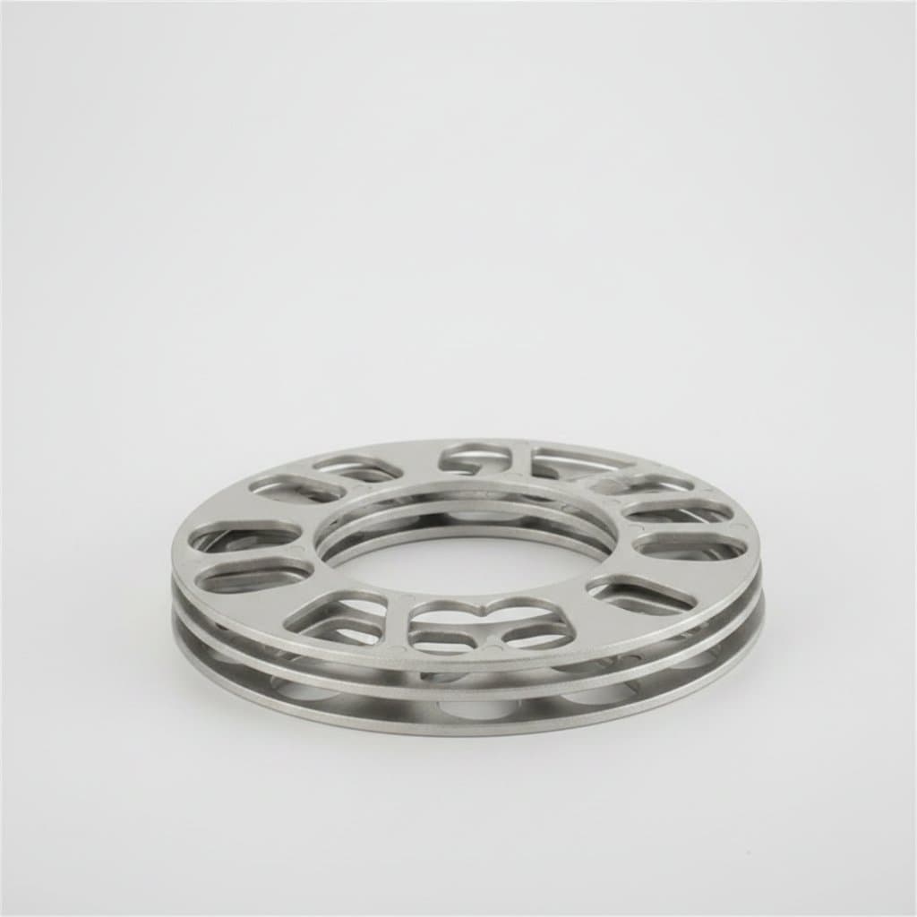 A silver aluminum alloy flange gasket, designed for car wheel hub modification, not a wheel chock.