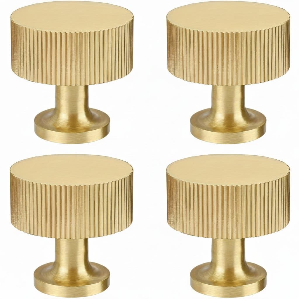 Retro brass cabinet knob with elegant ribbed design, suitable for drawers and dressing tables in a modern golden metal finish.