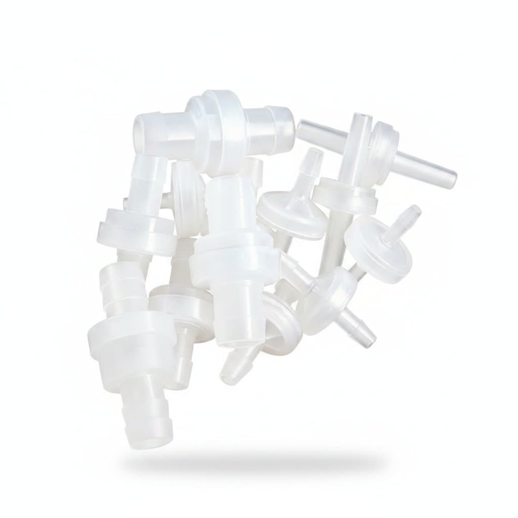 Fuel Line gate valve gate: multiple clear plastic check valves held in a hand.