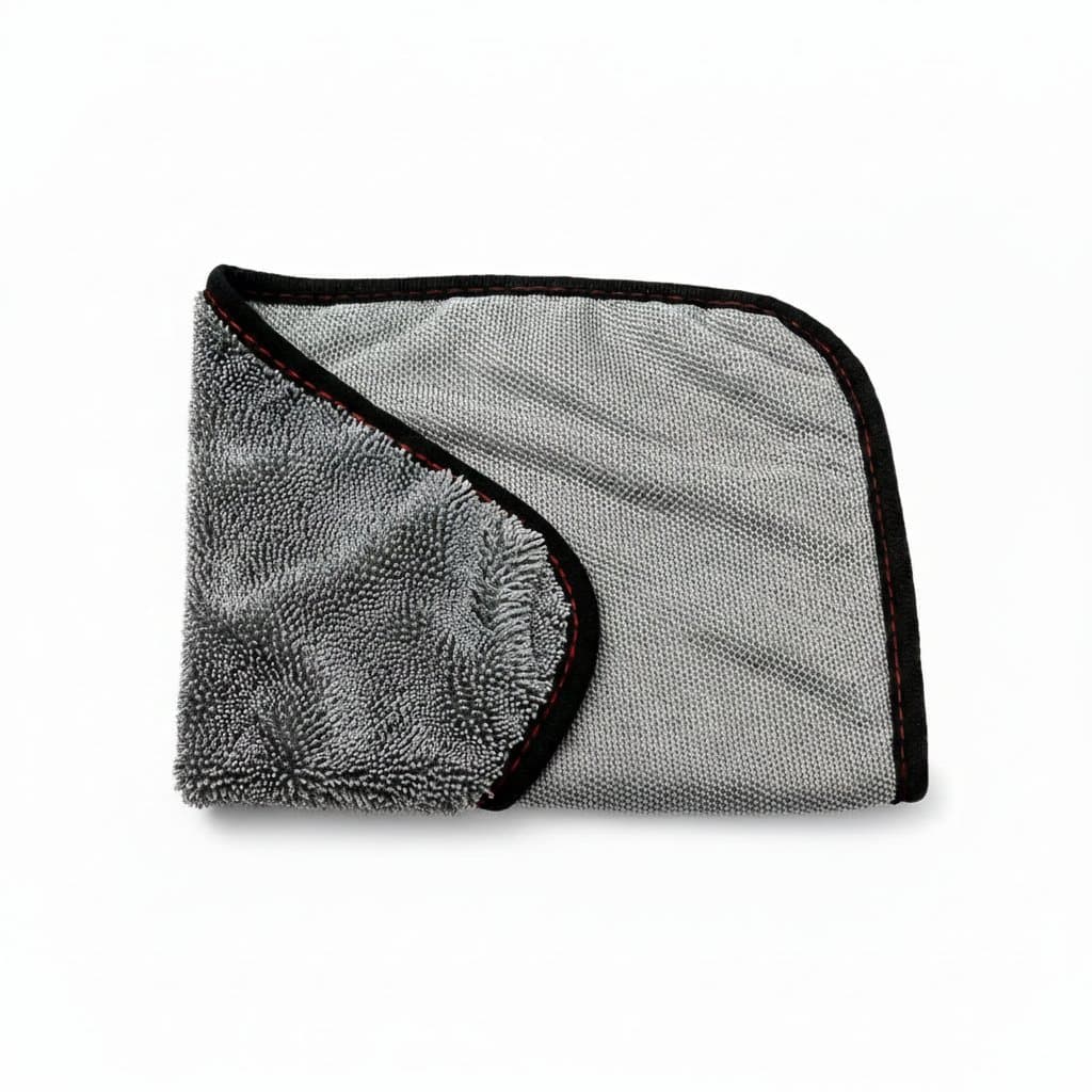 Microfiber cloths, a stack of neatly folded cleaning cloths.